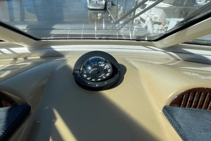 Slide: The Image of 2001 Carver 506 Motor Yacht helm compass view. - 19