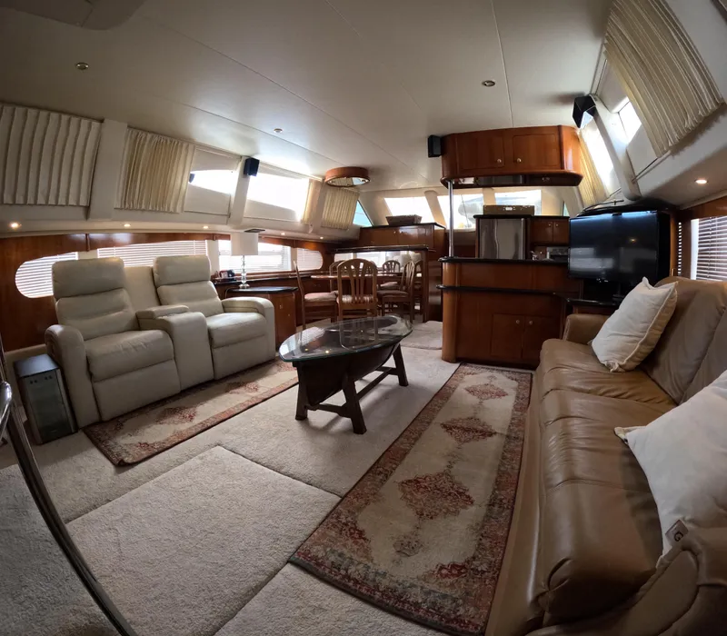 Slide: The Image of Luxurious interior of a 2001 Carver 506 Motor Yacht with plush seating and elegant decor. - 24