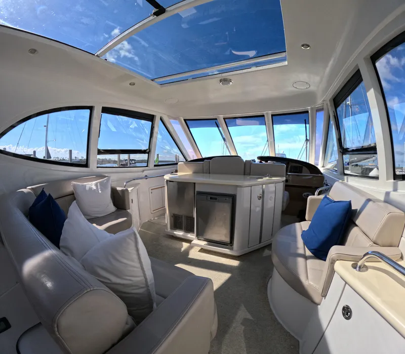 Slide: The Image of Interior of 2001 Carver 506 Motor Yacht with plush seating and panoramic windows. - 3
