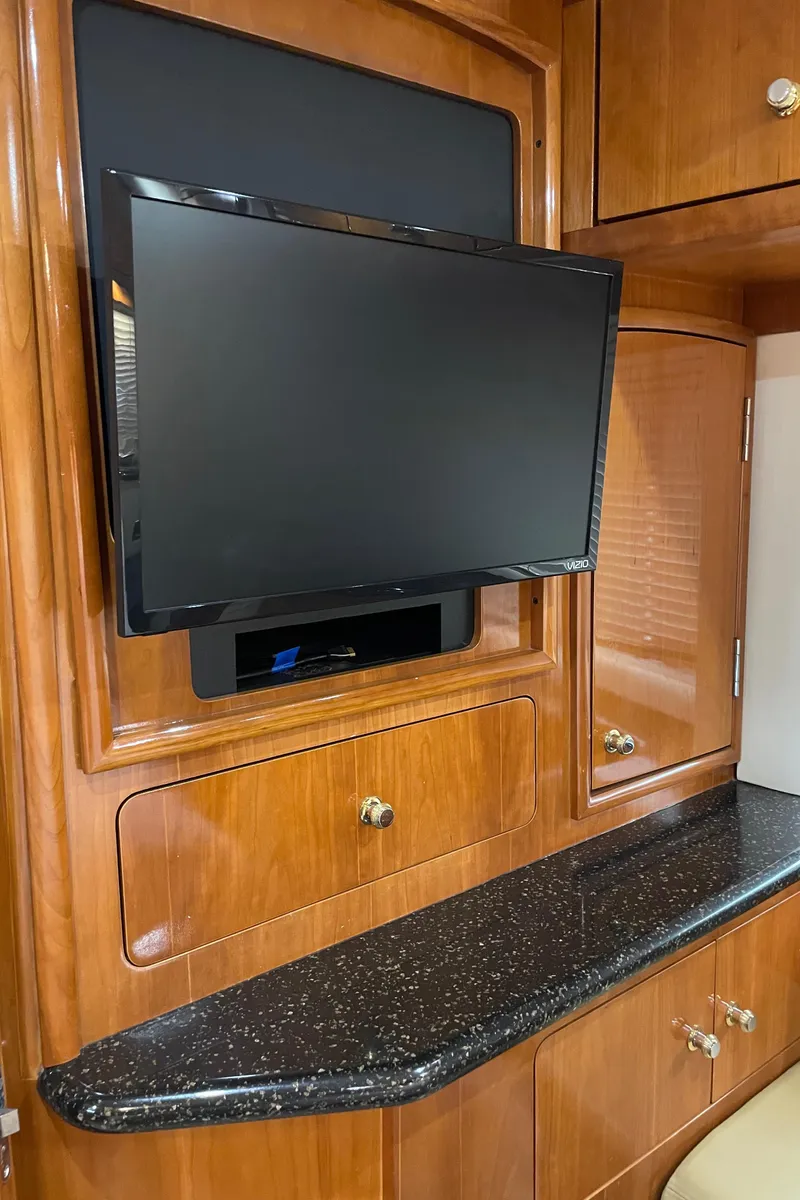 Slide: The Image of Flat-screen TV in 2001 Carver 506 Motor Yacht interior with wood cabinetry. - 45