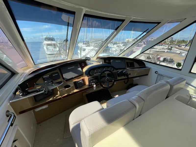 Slide: The Image of Interior helm of 2001 Carver 506 Motor Yacht with marina view. - 2