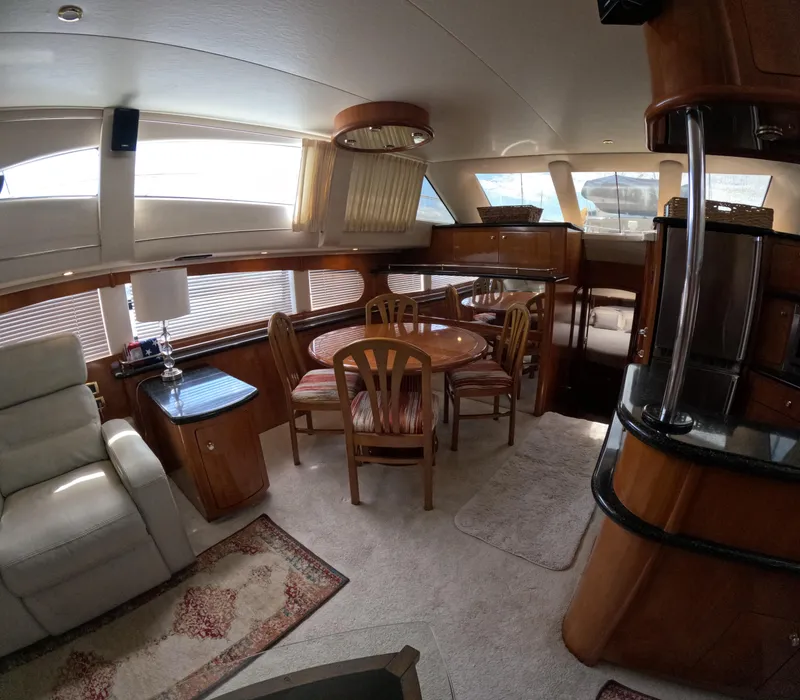 Slide: The Image of Interior of 2001 Carver 506 Motor Yacht with dining area and seating. - 26