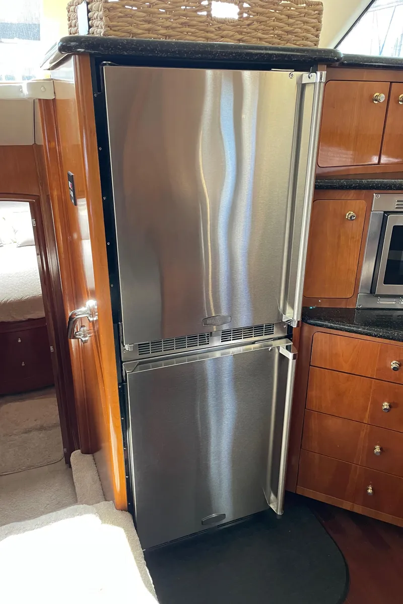 Slide: The Image of Stainless steel refrigerator in the kitchen of a 2001 Carver 506 Motor Yacht. - 32