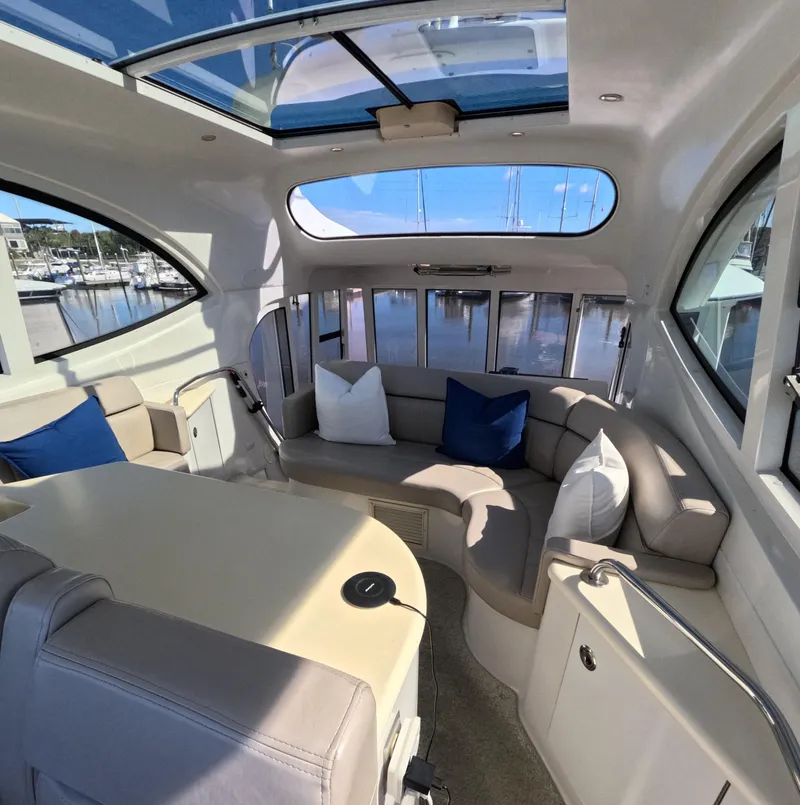 Slide: The Image of Interior of 2001 Carver 506 Motor Yacht with seating and panoramic windows. - 4