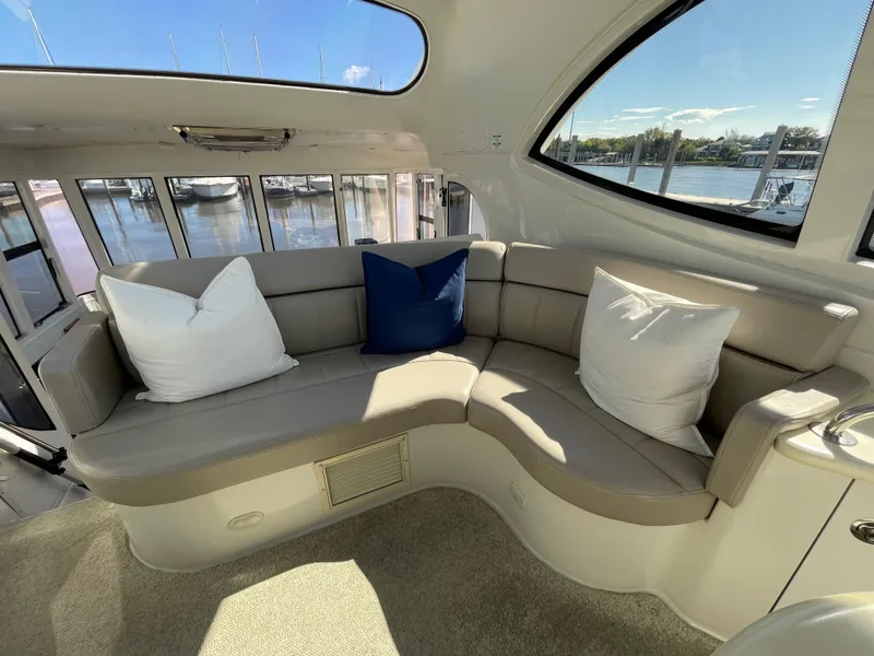 Slide: The Image of Interior seating area of a 2001 Carver 506 Motor Yacht with waterfront view. - 8