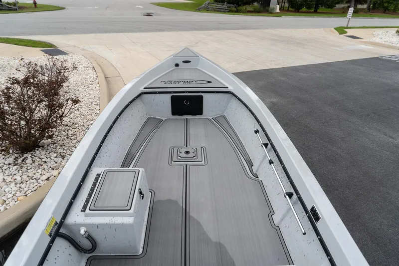 Slide: The Image of 2024 Mi Tide V1503 boat interior with sleek, modern design at a dock. - 6