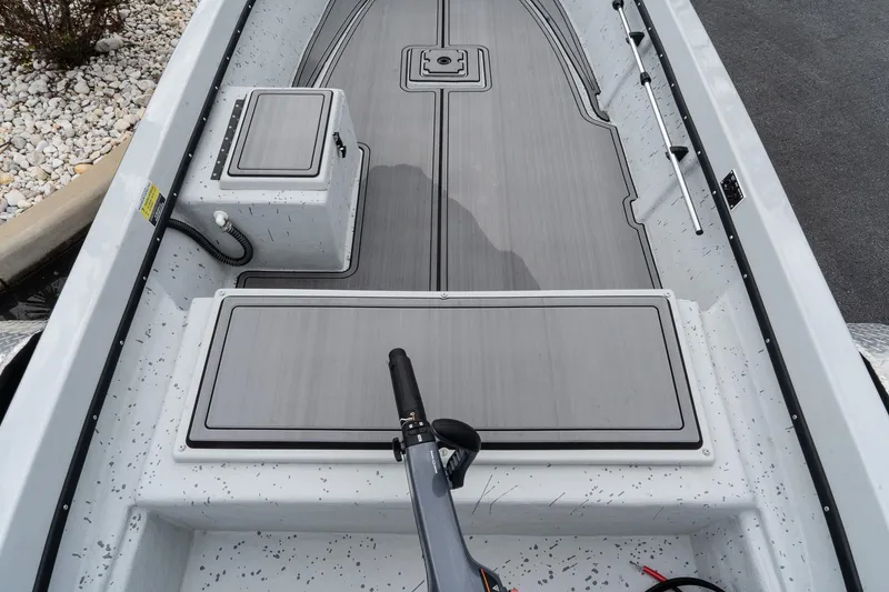 Slide: The Image of 2024 Mi Tide V1503 boat interior with sleek gray deck and storage compartments. - 8