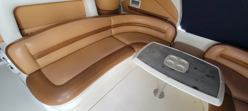 Slide: The Image of 2004 Sea Ray 455 Sundancer interior seating area with table. - 18