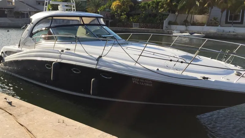 Slide: The Image of 2004 Sea Ray 455 Sundancer yacht docked in a marina. - 2