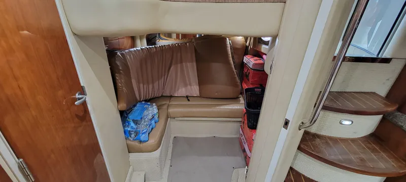 Slide: The Image of Interior cabin of a 2004 Sea Ray 455 Sundancer yacht with seating area. - 23