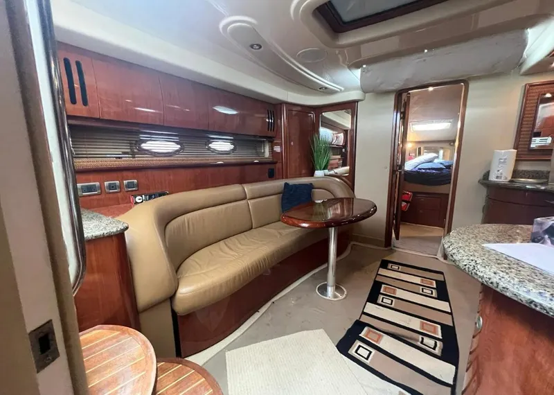 Slide: The Image of Luxurious interior of a 2004 Sea Ray 455 Sundancer yacht with leather seating and modern amenities. - 25