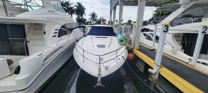 Slide: The Image of 2004 Sea Ray 455 Sundancer docked at marina with other boats. - 5