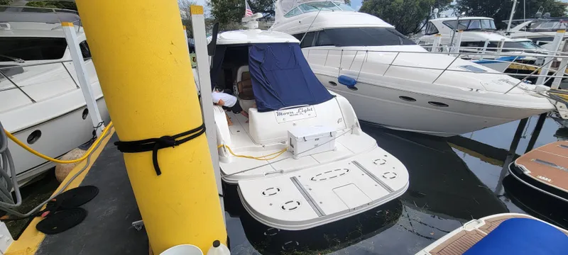 Slide: The Image of 2004 Sea Ray 455 Sundancer docked at marina. - 8