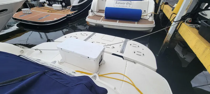 Slide: The Image of 2004 Sea Ray 455 Sundancer docked at marina with other boats. - 9