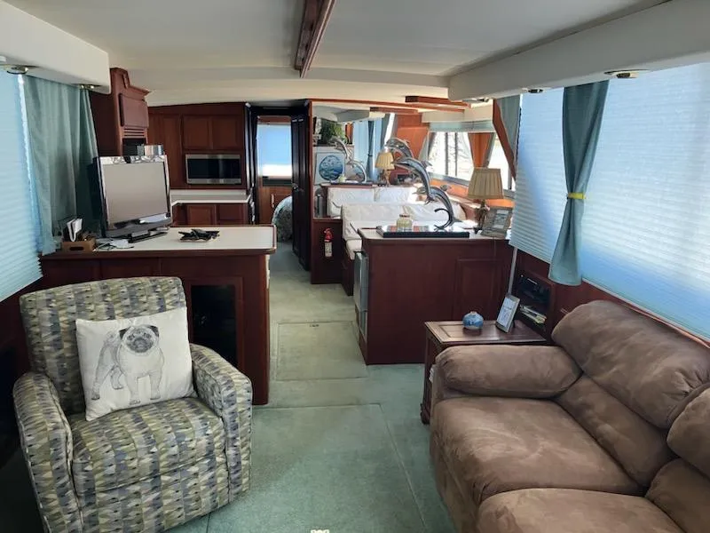 Slide: The Image of Interior of a 1989 Bluewater Yachts 55' Coastal Cruiser with cozy seating and modern amenities. - 15