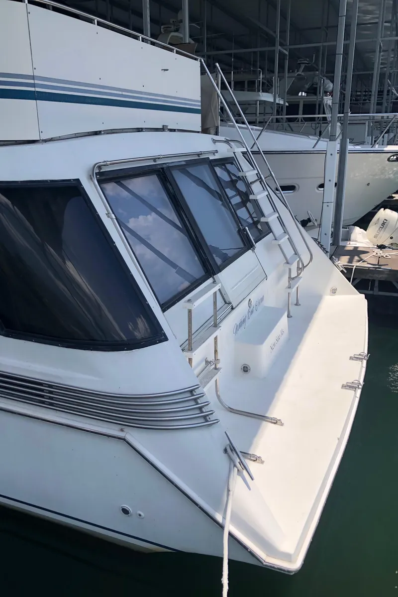 Slide: The Image of 1989 Bluewater Yachts 55' Coastal Cruiser docked in a marina. - 19
