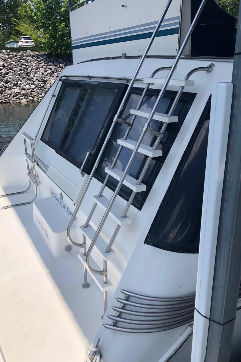 Slide: The Image of 1989 Bluewater Yachts 55' Coastal Cruiser with ladder and windows. - 21