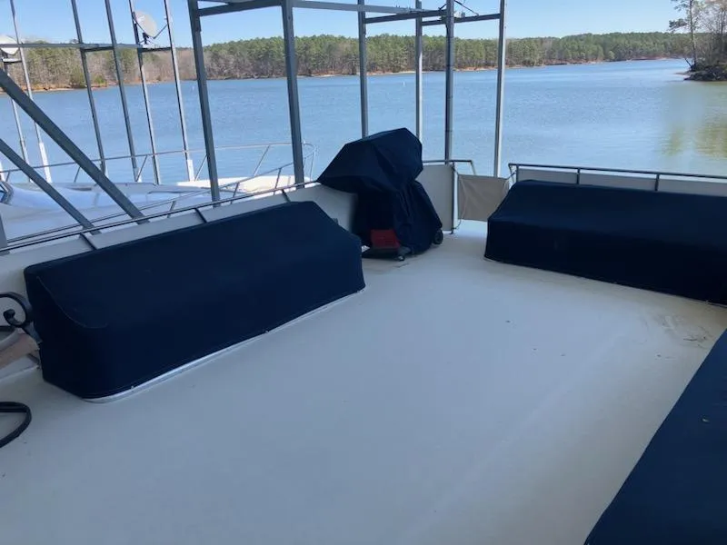 Slide: The Image of 1989 Bluewater Yachts 55' Coastal Cruiser deck with lake view. - 3