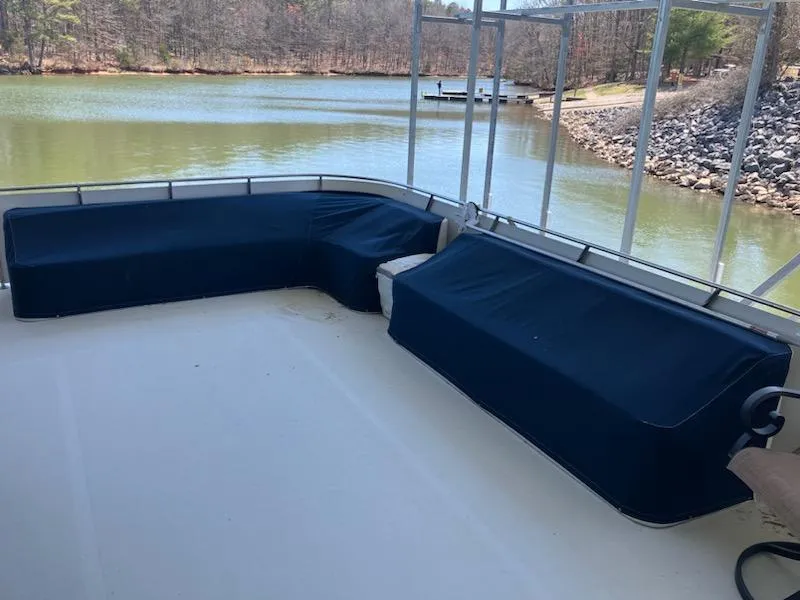 Slide: The Image of Spacious deck of 1989 Bluewater Yachts 55' Coastal Cruiser with covered seating. - 4