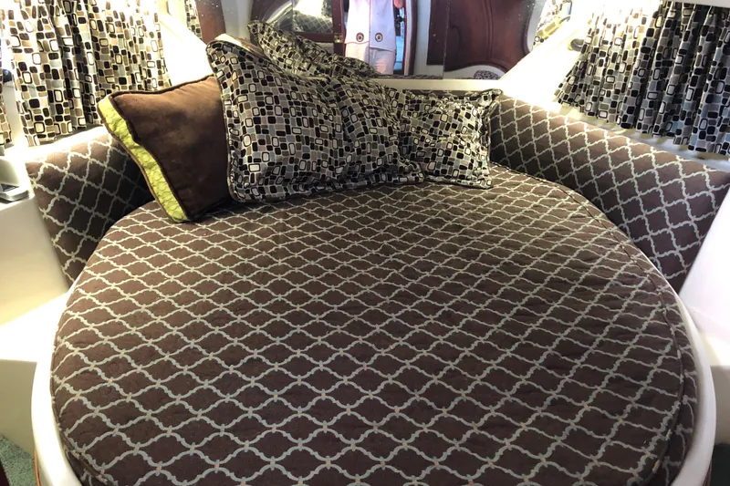 Slide: The Image of 1989 Bluewater Yachts 55' Coastal Cruiser bedroom with patterned bedding and pillows. - 42