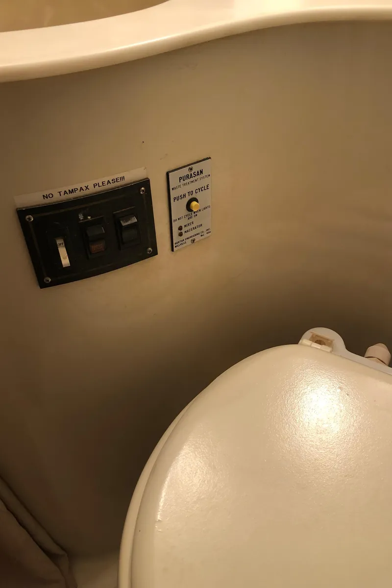 Slide: The Image of 1989 Bluewater Yachts 55' Coastal Cruiser bathroom with control panel. - 44