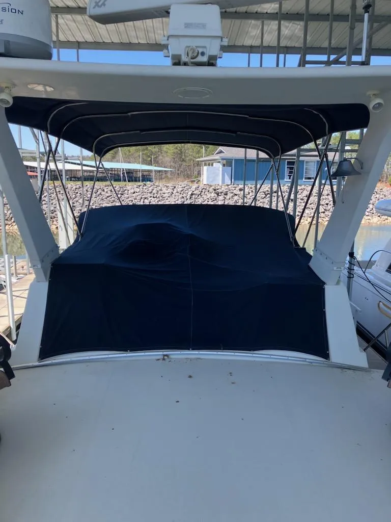 Slide: The Image of 1989 Bluewater Yachts 55' Coastal Cruiser with covered deck in marina. - 5