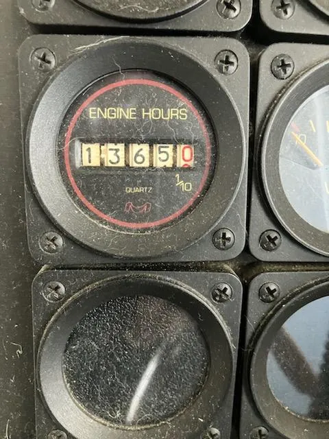 Slide: The Image of Engine hours gauge on a 1989 Bluewater Yachts 55' Coastal Cruiser showing 1365 hours. - 8