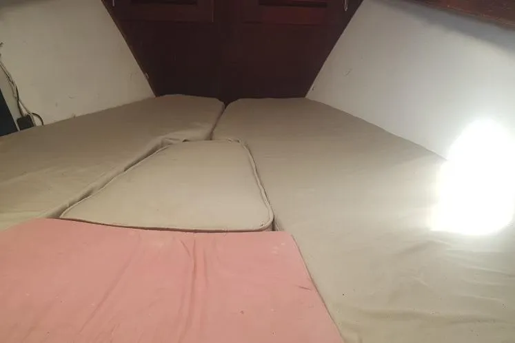 Slide: The Image of Interior cabin view of 1973 Hodgdon DOLPHIN 47 sailboat with beige cushions. - 11