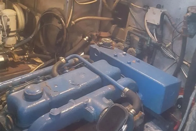 Slide: The Image of Engine room of 1973 Hodgdon DOLPHIN 47 with blue machinery and pipes. - 13