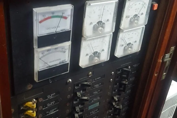 Slide: The Image of Electrical panel with gauges and switches on a 1973 Hodgdon DOLPHIN 47 yacht. - 17