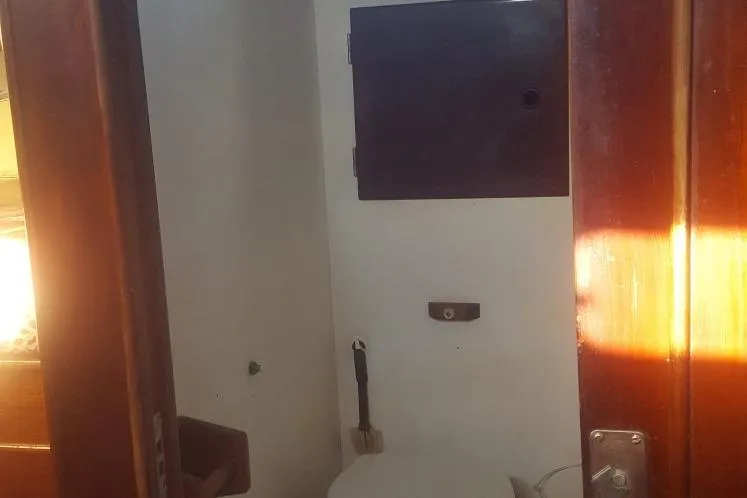 Slide: The Image of Interior of 1973 Hodgdon DOLPHIN 47 yacht bathroom with wooden accents. - 20