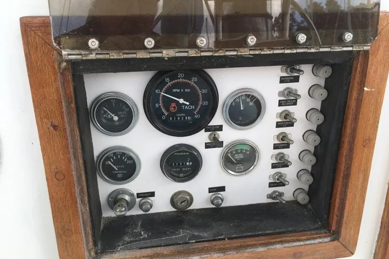 Slide: The Image of Control panel of 1973 Hodgdon DOLPHIN 47 boat with gauges and switches. - 23