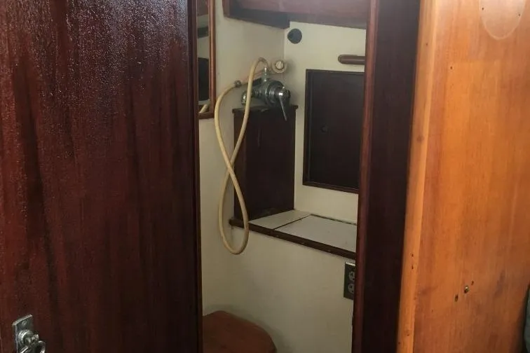 Slide: The Image of Interior of 1973 Hodgdon DOLPHIN 47 yacht showing wooden bathroom with shower. - 25