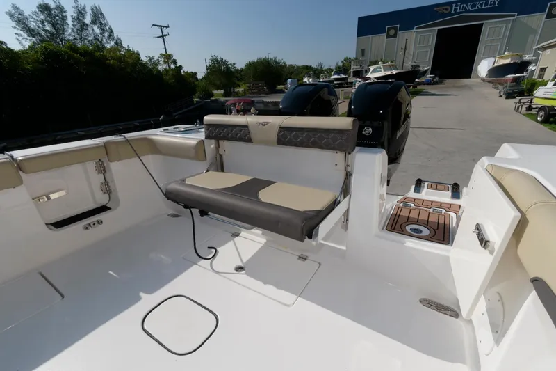 Slide: The Image of 2023 Tidewater 320 CC Adventure boat with seating and outboard motors. - 10