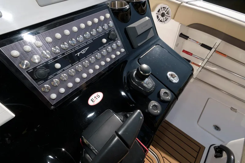 Slide: The Image of Control panel of the 2023 Tidewater 320 CC Adventure boat. - 16