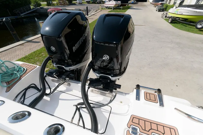 Slide: The Image of 2023 Tidewater 320 CC Adventure boat with twin Mercury outboard engines. - 18