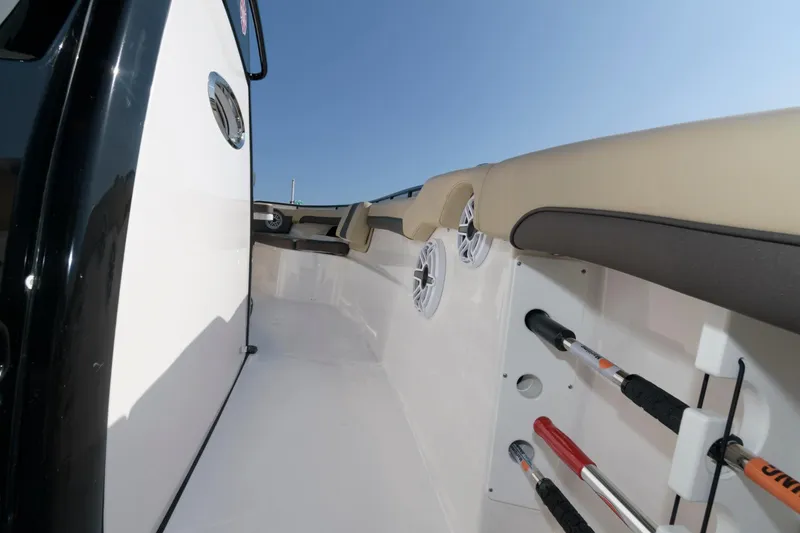 Slide: The Image of 2023 Tidewater 320 CC Adventure boat interior with rod holders and speakers. - 20
