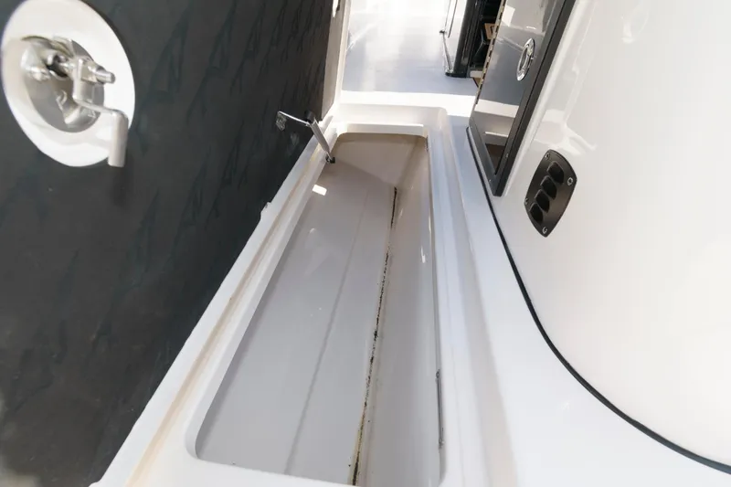 Slide: The Image of 2023 Tidewater 320 CC Adventure boat storage compartment. - 23