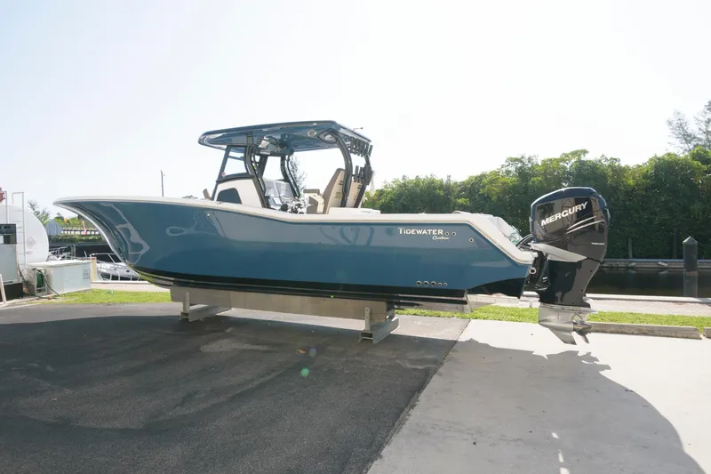 Slide: The Image of 2023 Tidewater 320 CC Adventure boat with Mercury outboard engines. - 4