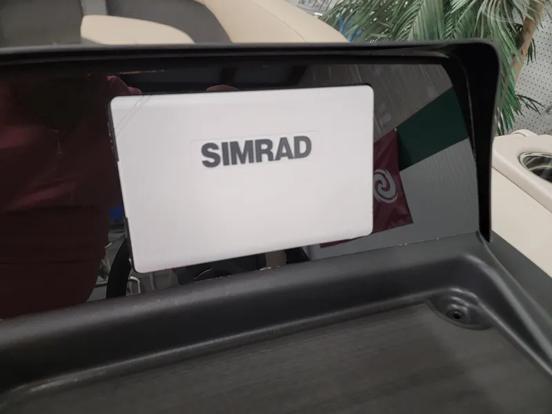 Slide: The Image of 2024 Harris Cruiser 250 boat dashboard with Simrad navigation system. - 10