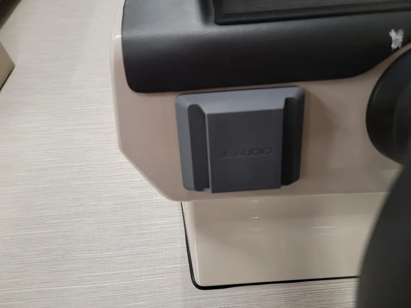 Slide: The Image of JL Audio component on 2024 Harris Cruiser 250 boat dashboard. - 11