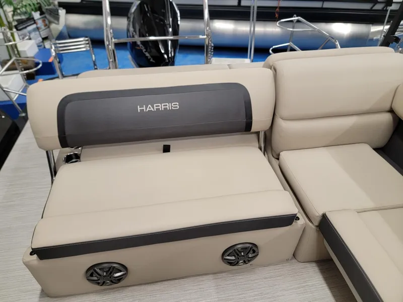 Slide: The Image of 2024 Harris Cruiser 250 boat interior seating with built-in speakers. - 14