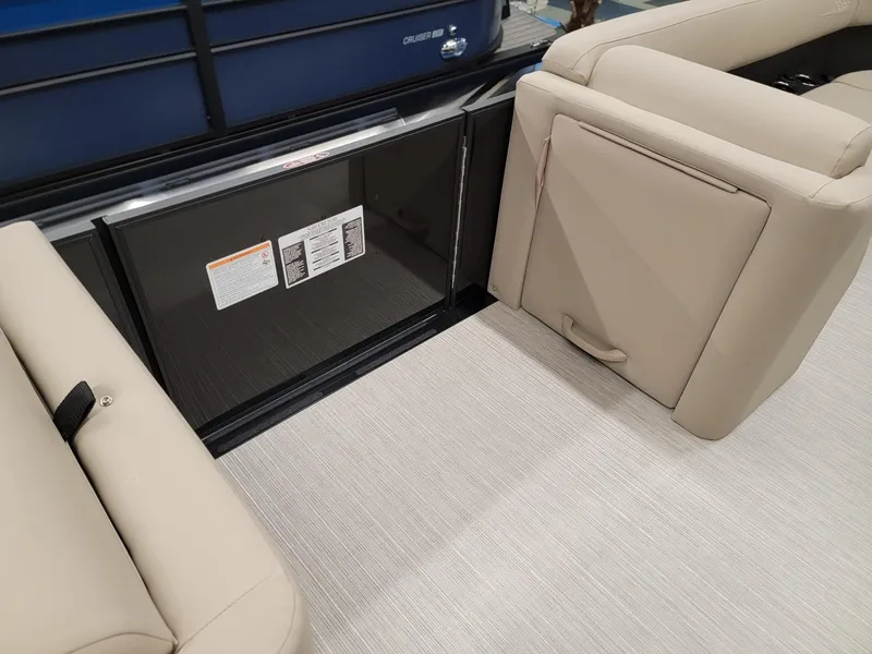 Slide: The Image of 2024 Harris Cruiser 250 interior seating and storage compartment. - 24