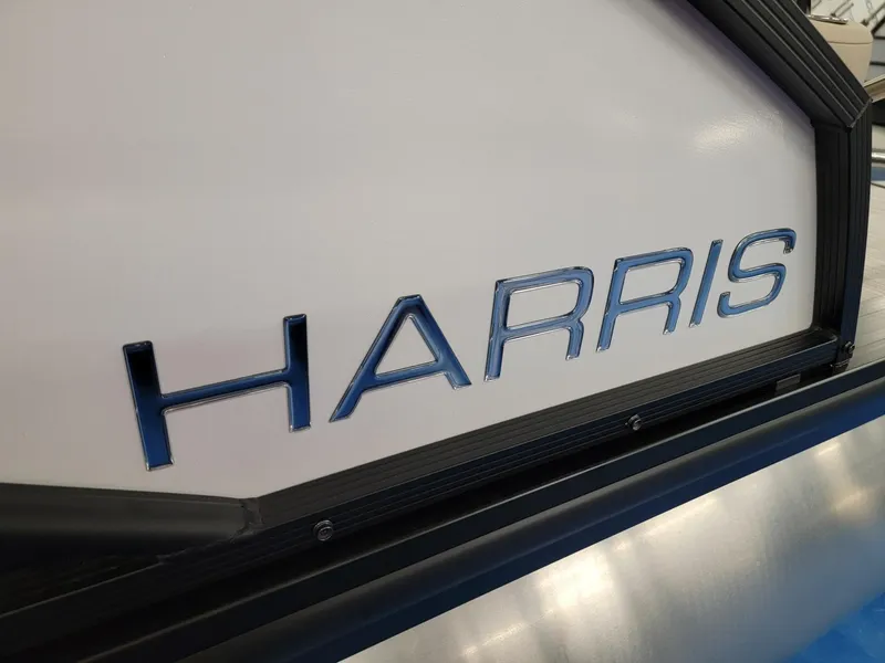Slide: The Image of 2024 Harris Cruiser 250 boat logo close-up. - 30