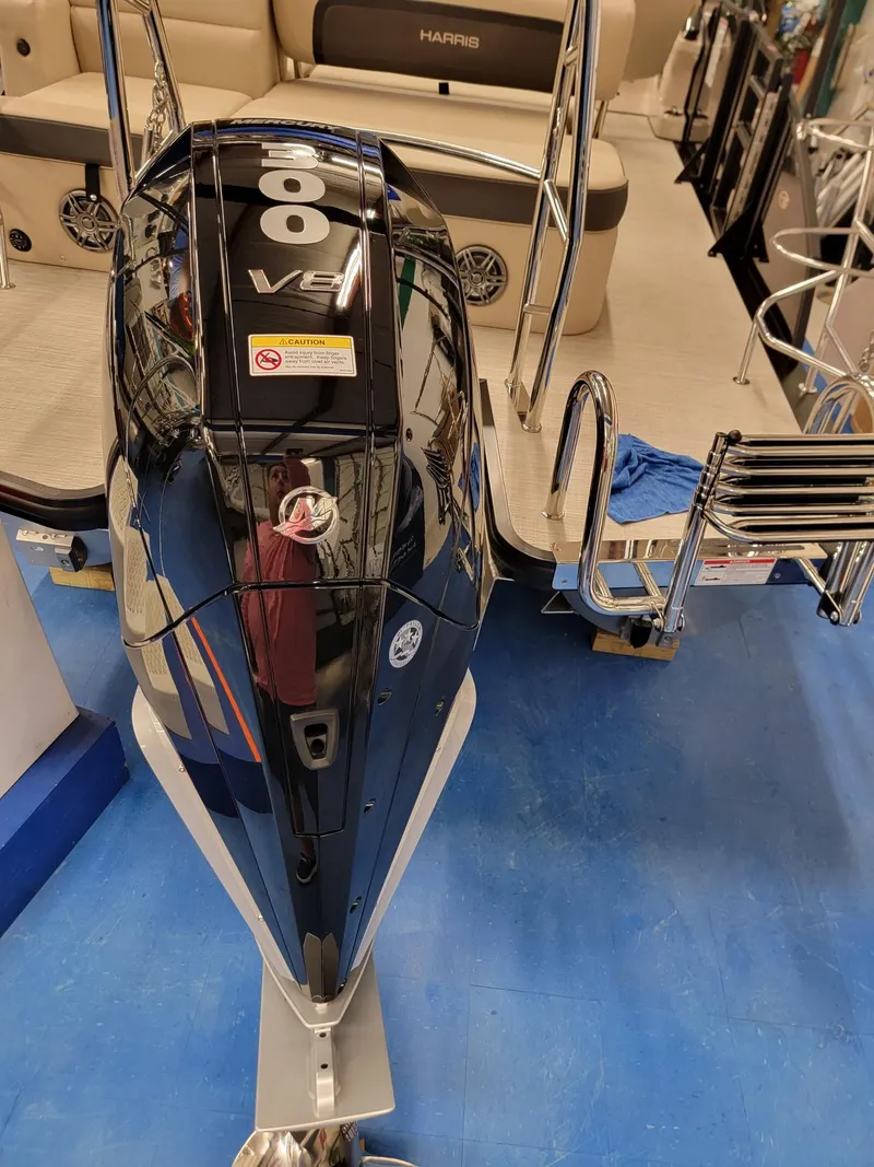 Slide: The Image of 2024 Harris Cruiser 250 boat with powerful V8 engine on display. - 31