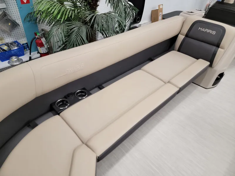 Slide: The Image of 2024 Harris Cruiser 250 boat interior with beige and black seating. - 5