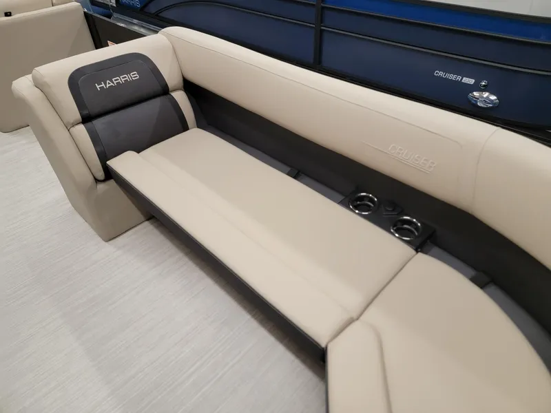 Slide: The Image of 2024 Harris Cruiser 250 boat interior with beige and black seating. - 6