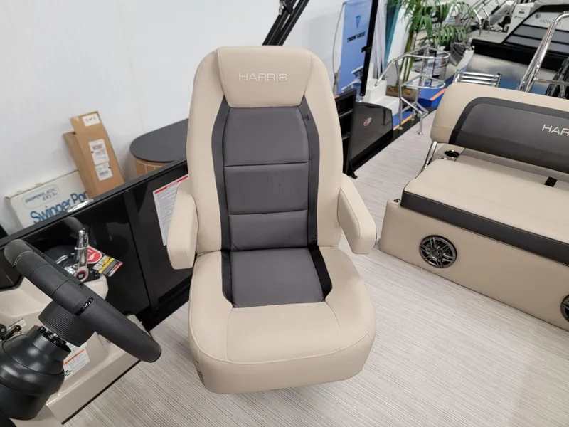 Slide: The Image of 2024 Harris Cruiser 250 boat captain's chair in beige and gray. - 8