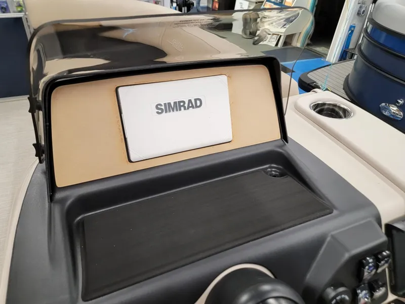 Slide: The Image of 2024 Harris Cruiser 210 boat dashboard with Simrad display. - 14
