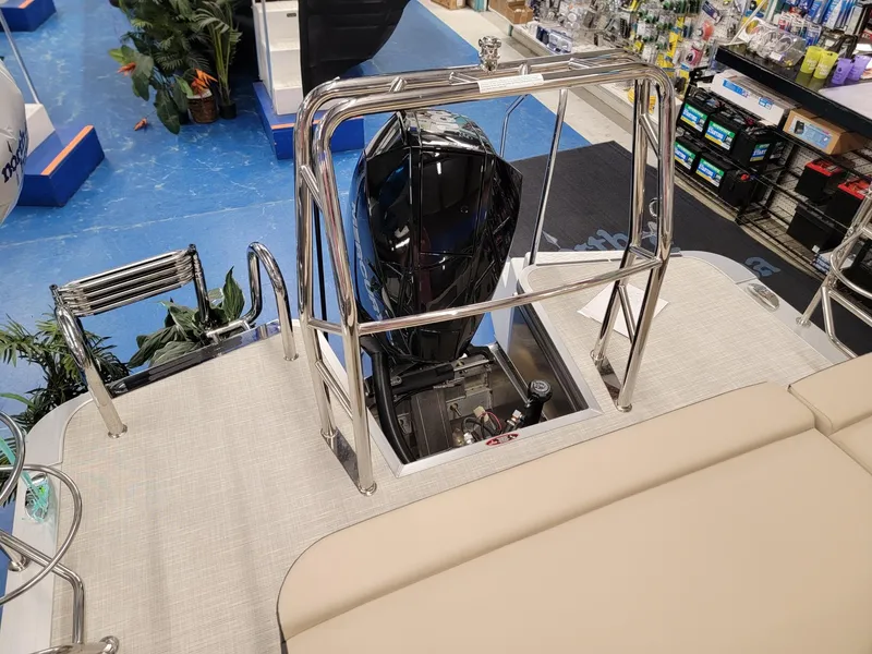 Slide: The Image of 2024 Harris Cruiser 210 boat with outboard motor in showroom. - 21